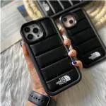 Aventurine Accessories The North-Face leather puffer frame lens stand for Apple iPhone 14 (6.1 inch)