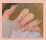 Secret Lives Acrylic Press on Artificial Designer Glossy Fake Nails Extension Nude Color 3D Butterfly White Pearl and Silver Glitter Design 24 pcs Set with Glue Sheet