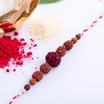 LOOK AND ADORN Handmade Naba Rudraksh Designer Rakhi with Roli Chawal