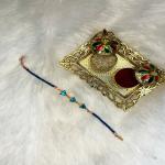 Mahi Rose Gold Plated Aqua Blue Triangle Shape Crystal Bracelet Rakhi for Bhaiya, Brother, Bhai, Bro (RA1100809ZABlu)