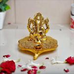 Kridaykraft Metal Ganesha Sitting on Leaf Patta with Diya Deepak Home Office Temple Pooja/Festival Good Luck/Wishes/Diwali/Gifting Ganesh Gold Polish Leaf for Home Decor and Gift Purpose.(12 x12 x 8 cm)