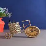 DazzCraft Iron Hand-painted Antique Small Cycle Pen Stand with Clock, Antique Showpiece, Decorative Showpiece, Figurine, Pen Stand for Home, Office, Study Table Decoration, Gift Items, Home Decoration & Showcase Items (10.2x3.7x6.8) Inch
