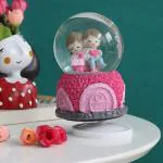 TIED RIBBONS Multicolor Rotating Cute Couple Glass Dome With Music Snowball Globe Showpiece 14X8 Cm