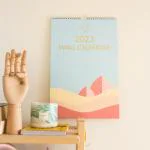 Comma Wall Calendar 2023 | 11.5 x 17.25 inch | 2-in-1 Glance and Landscape Design