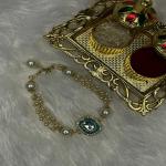 Mahi Gold Plated Classic Kundan and Artificial Pearl Studded Ethnic Lumba Rakhi (RAL1100816G)