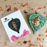 SATVIK 1 Pc Green Lord Ganesh Face on Leaf Patta Ganpati Idol Wall Hanging Decor Statue Hindu Good Luck Ganesha Face Sculpture Figurine Vastu Home Office Mandir Pooja Housewarming Return Gift Items