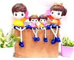99 Home Decor Orange Polyresin Family Hanging Legs Doll Showpiece 17 cm (Set of 4)