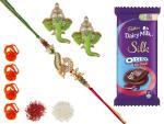 Feastive Celebrations Blessed Rakhi With Cadbury Dairy Milk Silk Oreo Red Velvet, Pair Of Soan, Pooja Rakhi, Kesar And Chawal (Set Of 7)
