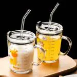 RIOMTRIC Glass Drinking Milk 350 ml (Pack of 2)Juice Mug with Handle and Lid with Cartoon Random
