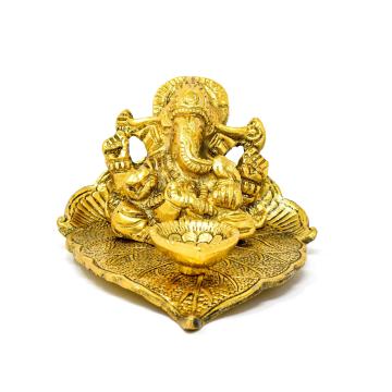 Style Homez TVASHTR ART, Lord Ganesha Sitting in Reclining Position on Peepal Patta with Diya in Front Gold Plated Metal Statue Décor, Antique Finish Decorative Showpiece