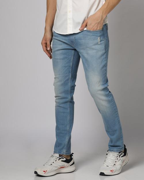 Mid-Wash Ripped Slim Tapered Fit Jeans