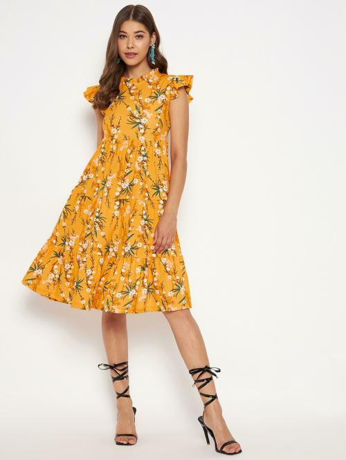High neck tiered stretchable midi dress with ruffled cap sleeves.The high neck with ruffle detailing looks cute & stylish.This dress is comfortable, breathable & perfect for summers.The comfortable hip silhouette is perfect for the Indian body type.