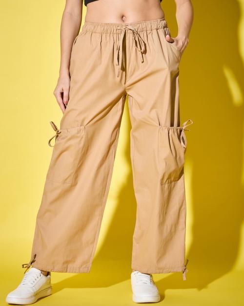 Buynewtrend Cotton Blend Beige Solid Women’s Cargo Pants | Adjustable Tie-Side Cargo Pockets